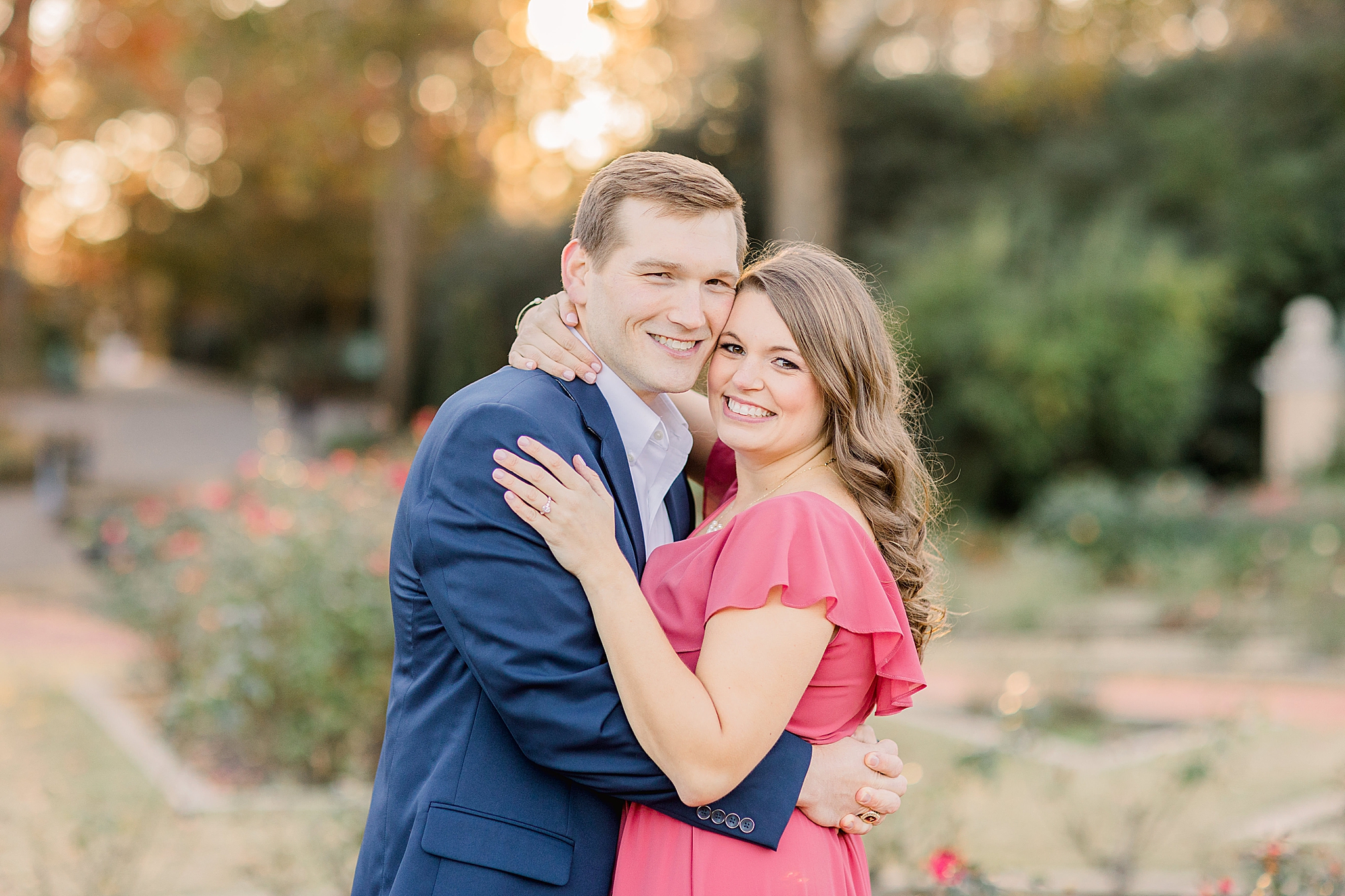 engaged couple touches head during fall engagement session at sunset
