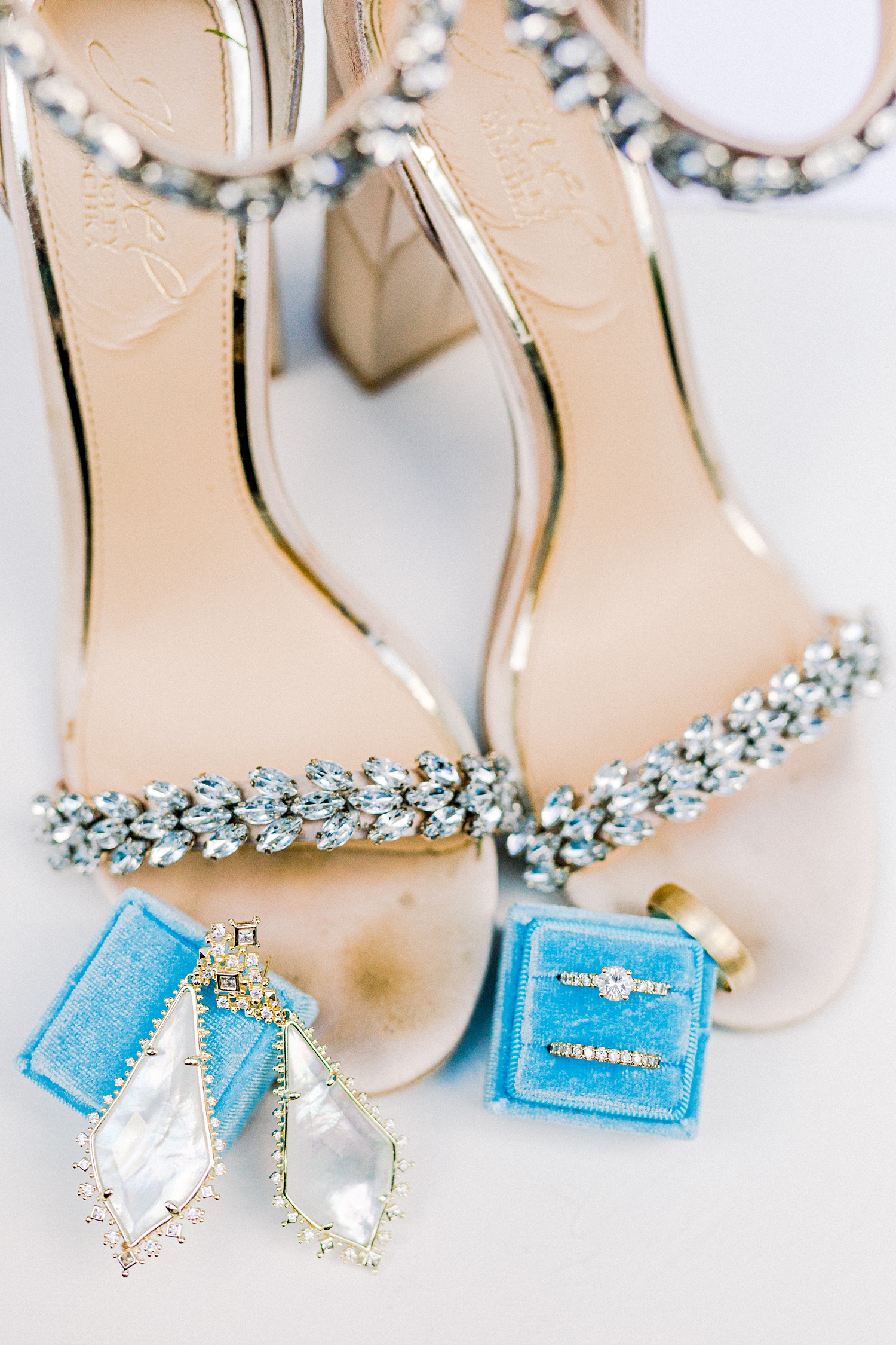bride's rings rest in teal box during Douglas Manor wedding