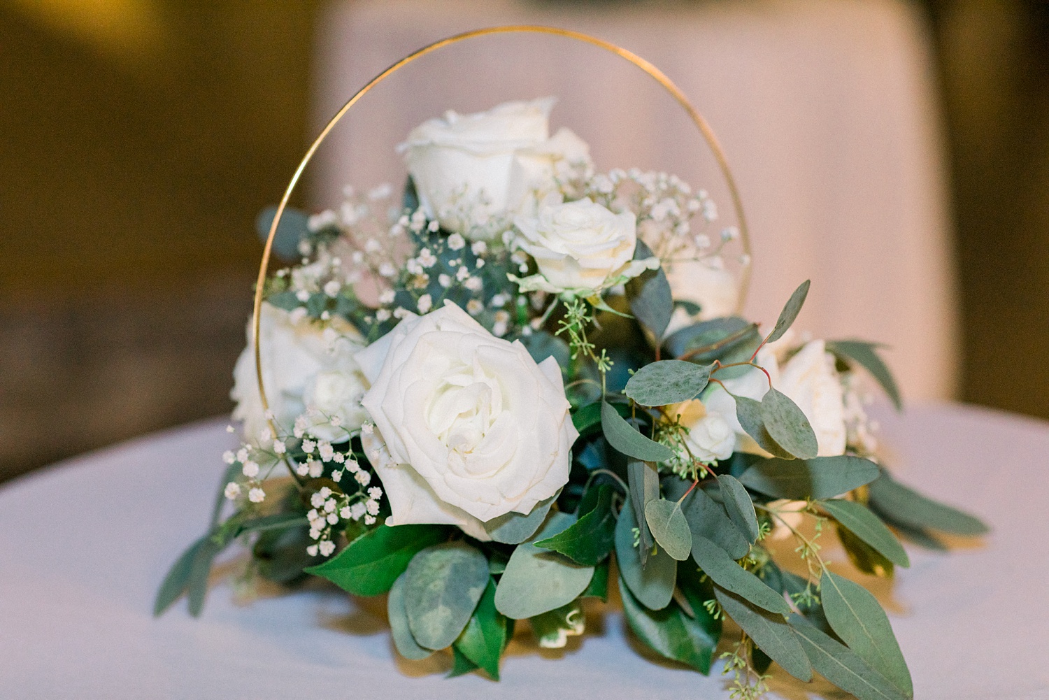 centerpieces with gold details and white flowers for rustic wedding reception at Douglas Manor