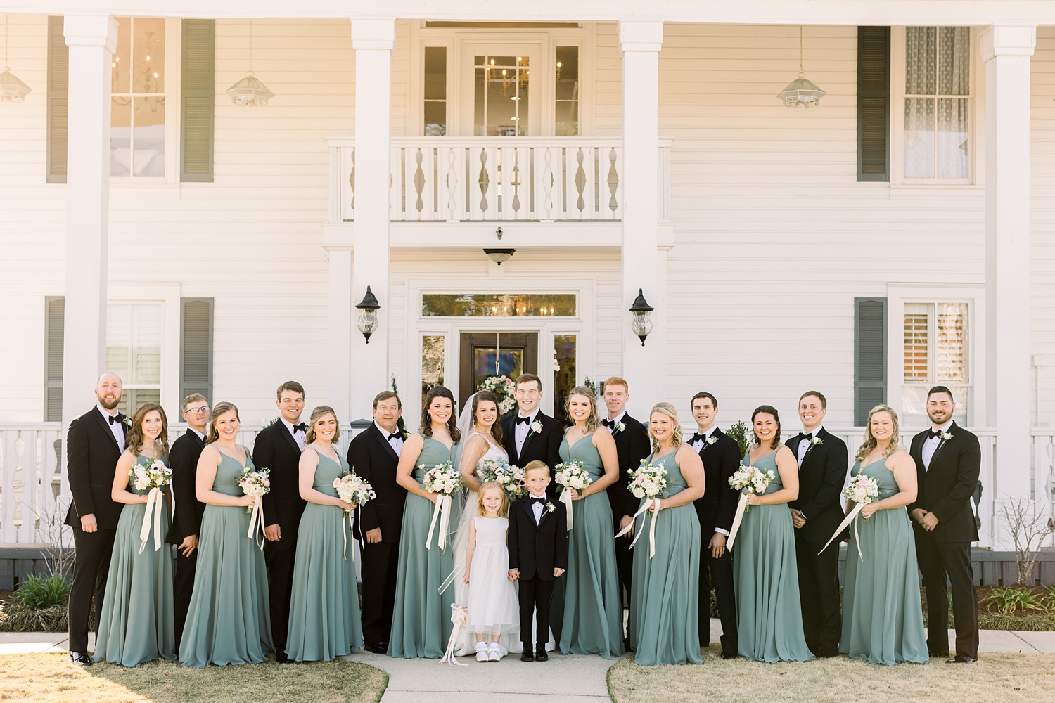 bride and groom pose with large bridal party in Birmingham AL