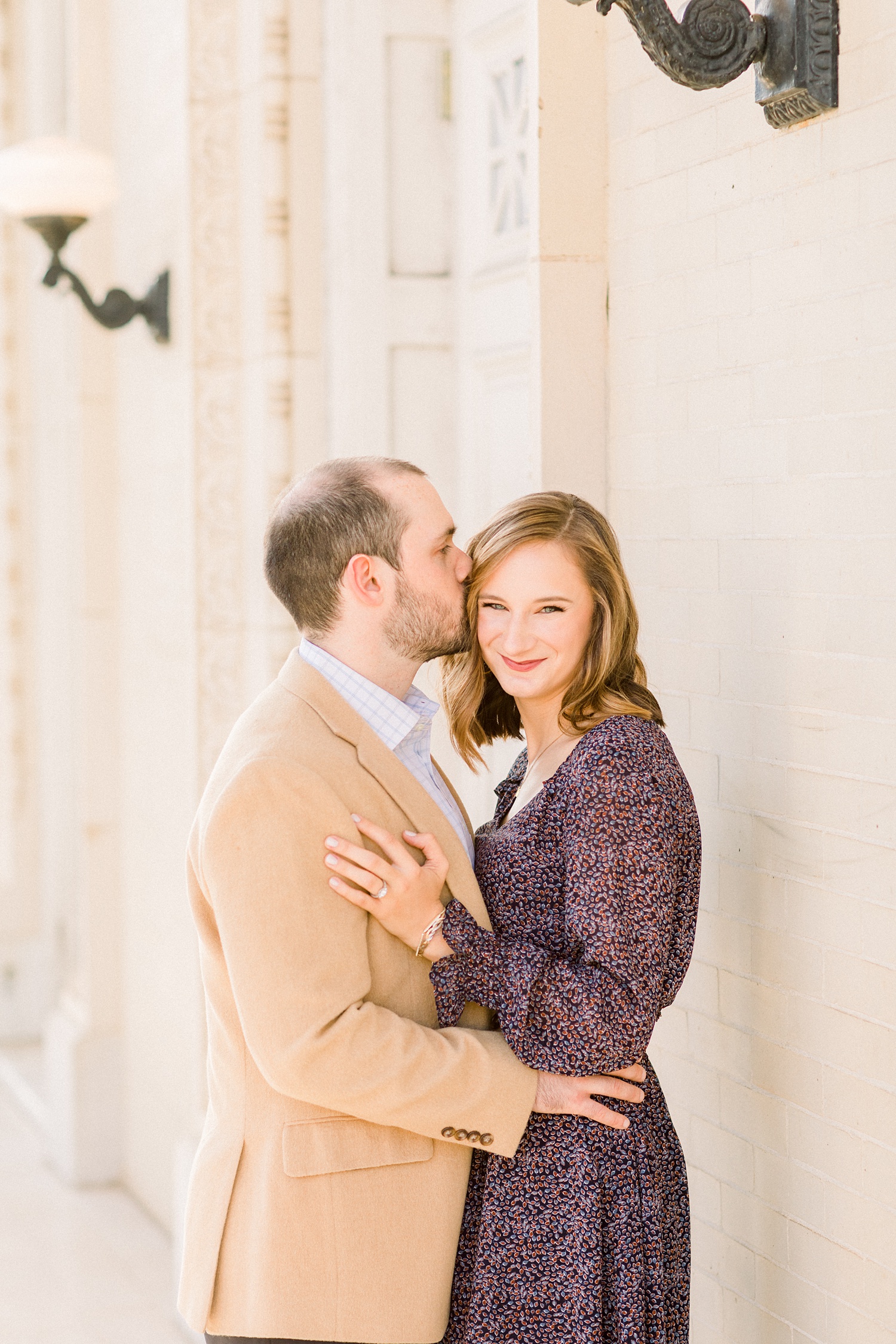 groom kisses bride's forehead during Downtown Birmingham engagement session
