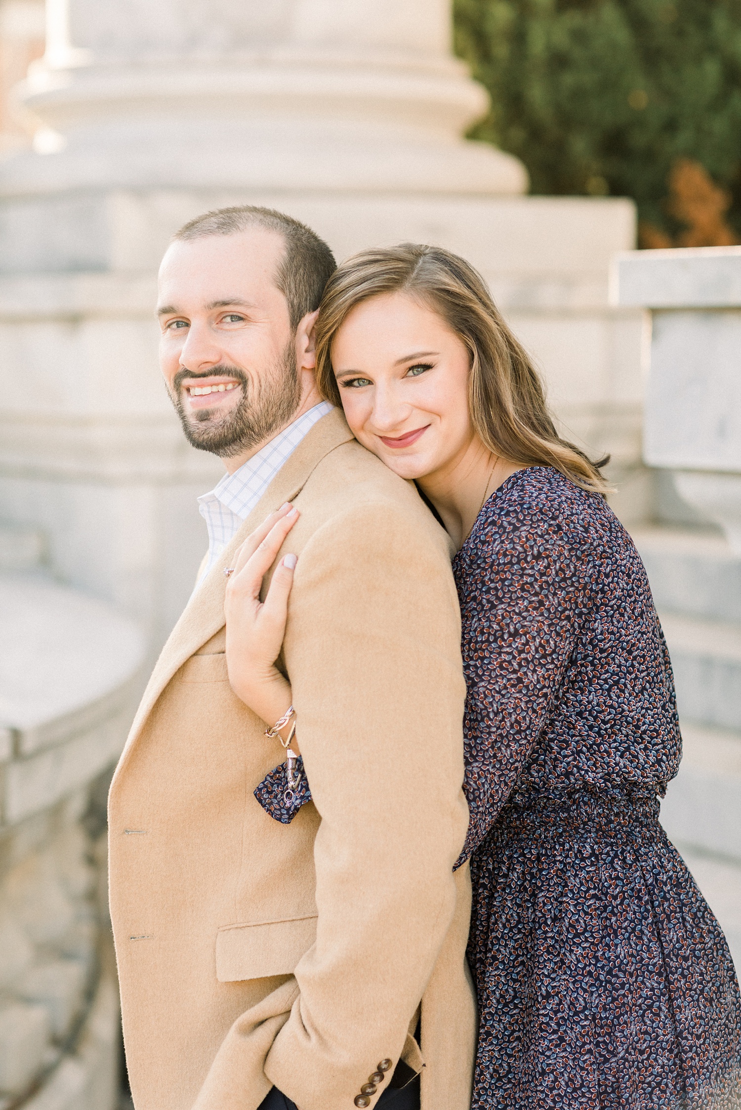 bride leans on groom during Downtown Birmingham engagement session