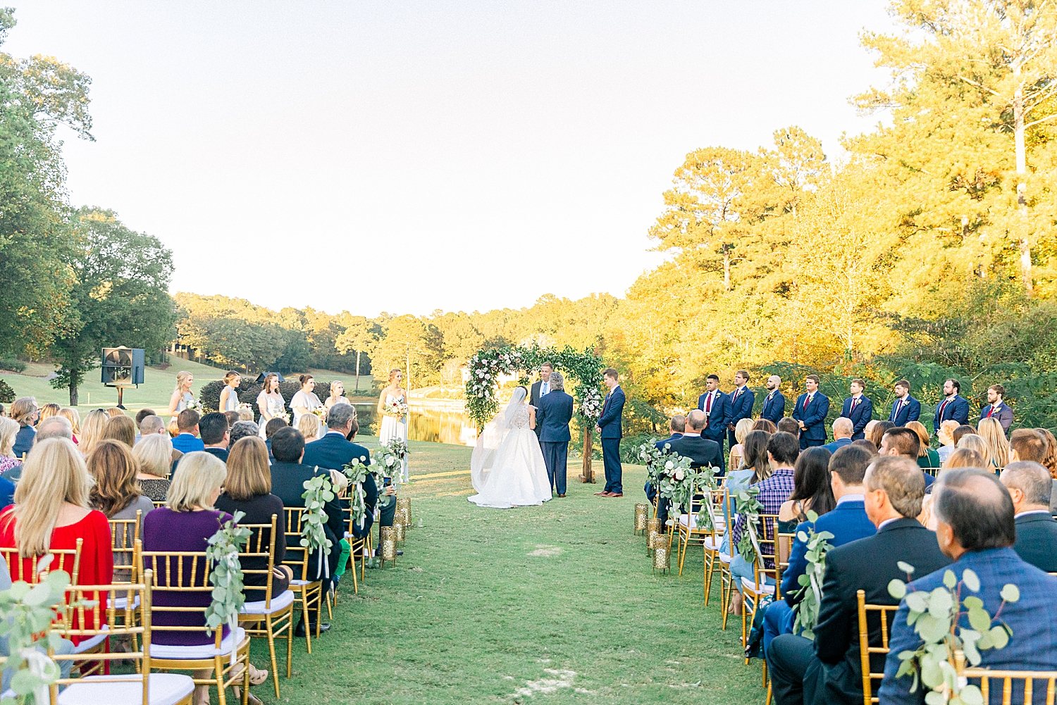 Riverchase Country Club fall wedding ceremony outdoors with floral arbor
