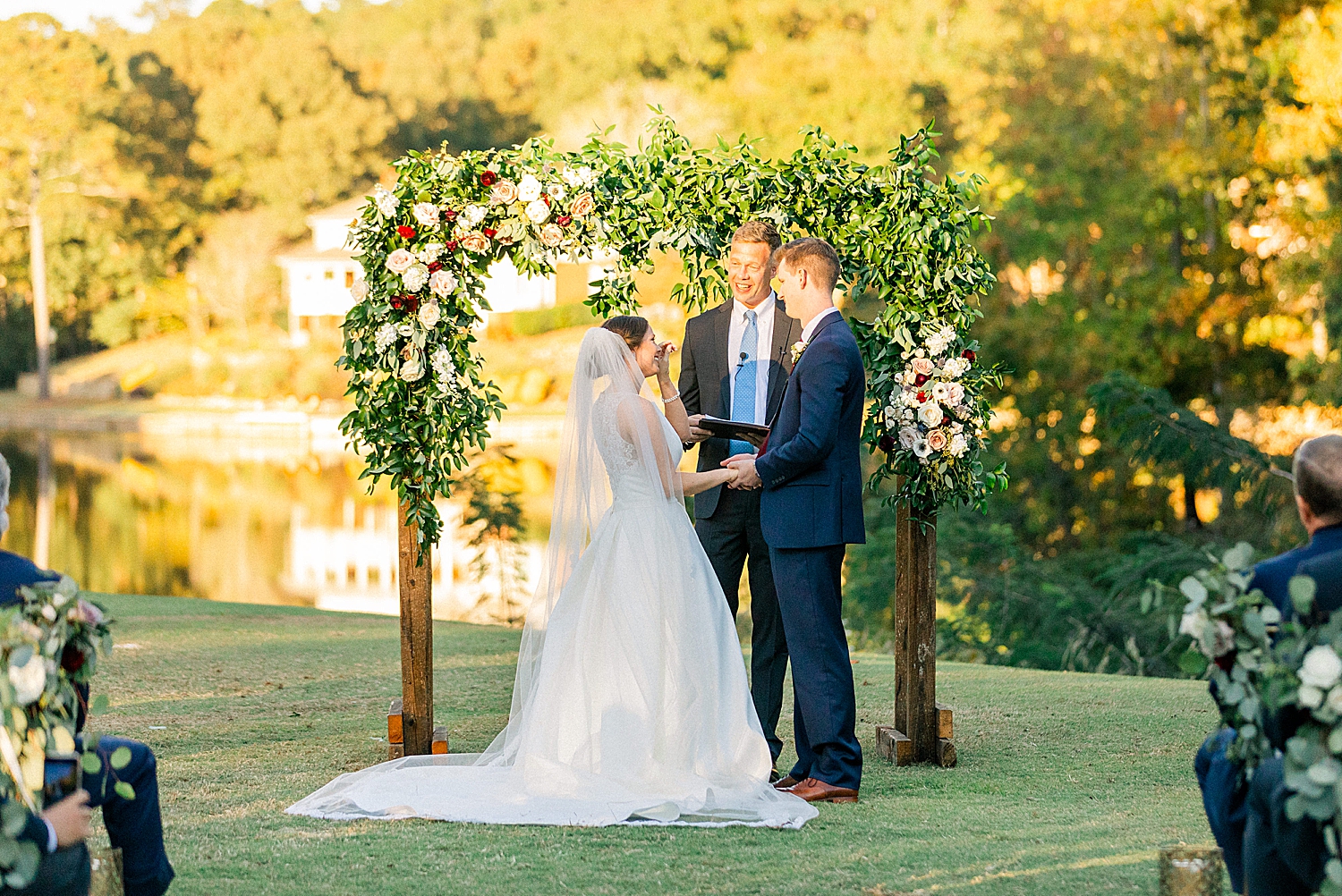 bride and groom laugh during Riverchase Country Club fall wedding ceremony