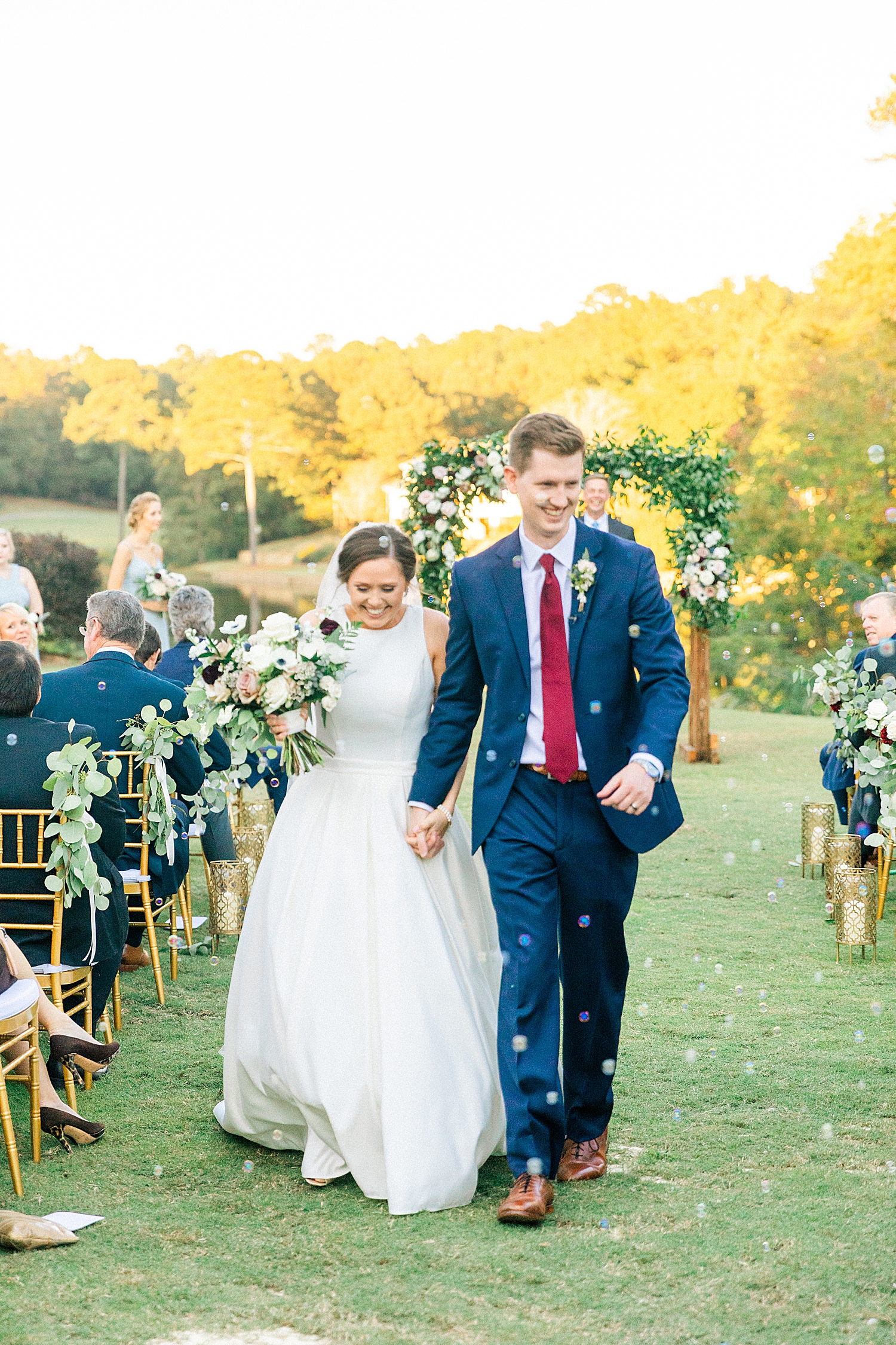 bride and groom leave ceremony at Riverchase Country Club