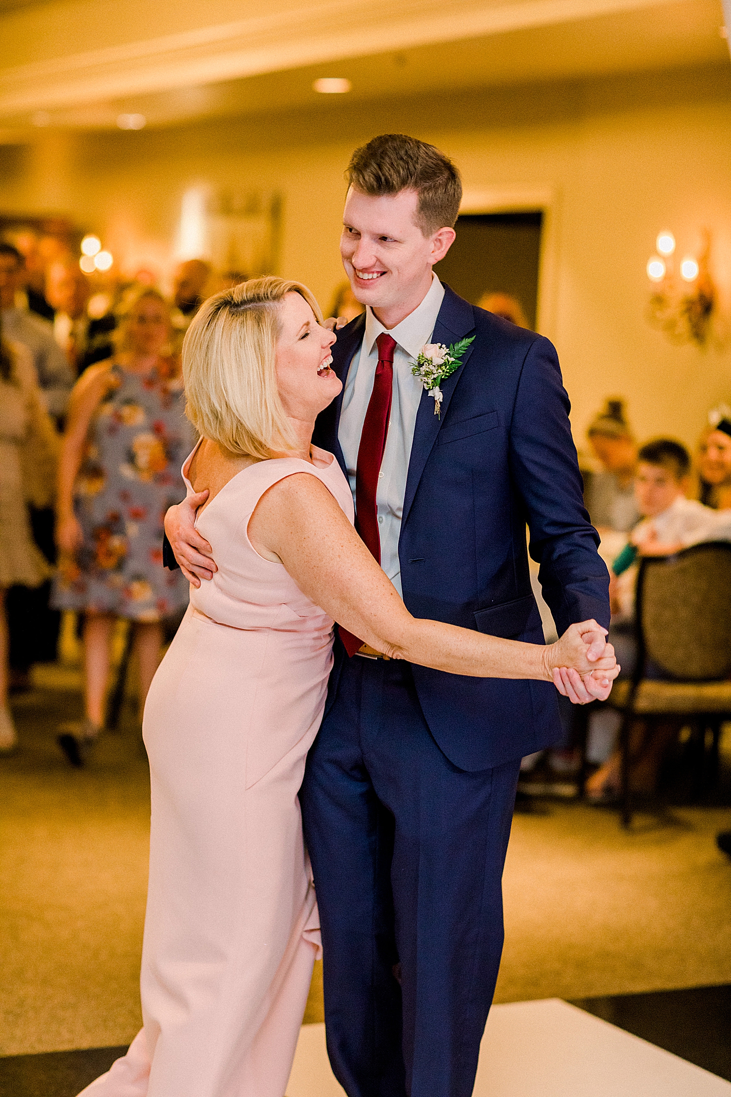 mom and groom dance together at Birmingham AL wedding reception