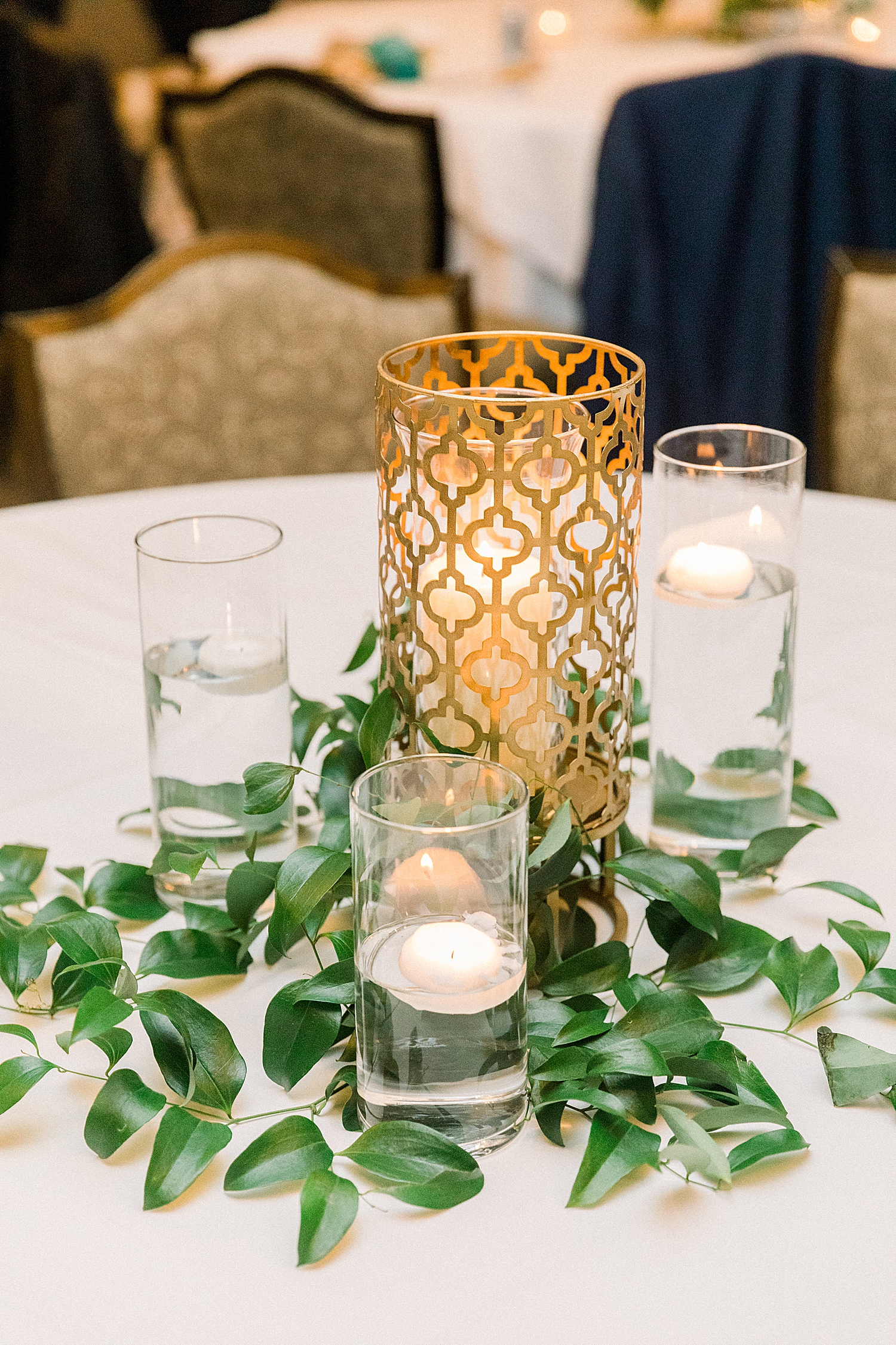 centerpiece with gold light and three candles