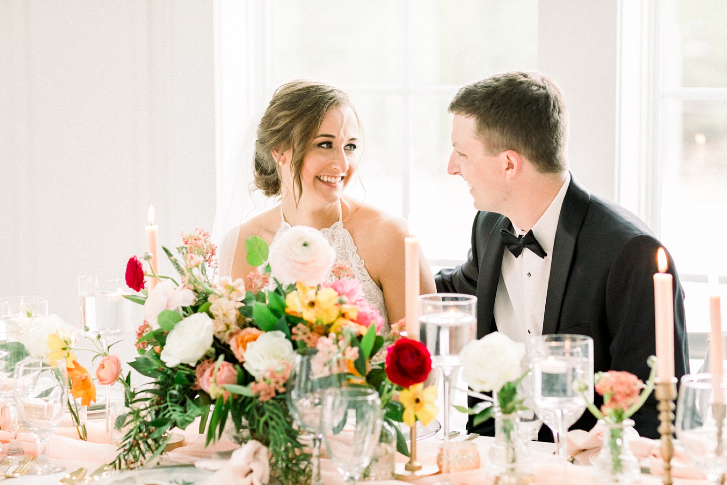 bride and groom laugh together during Alabama reception