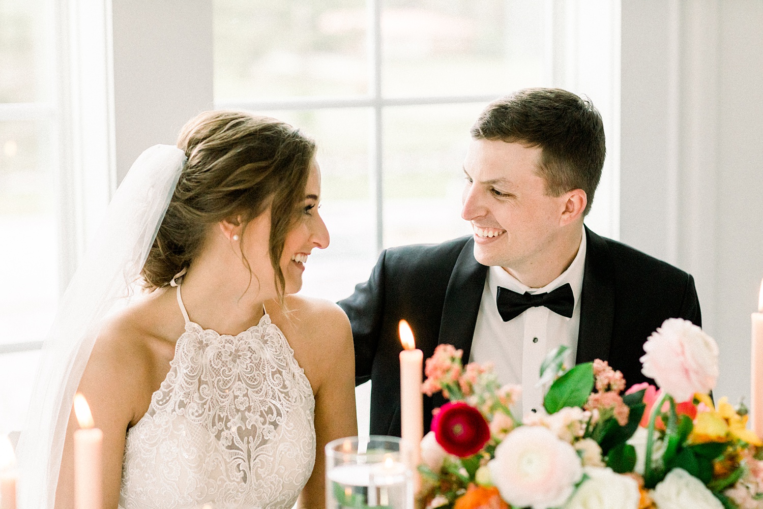 bride and groom laugh during wedding reception in Alabama