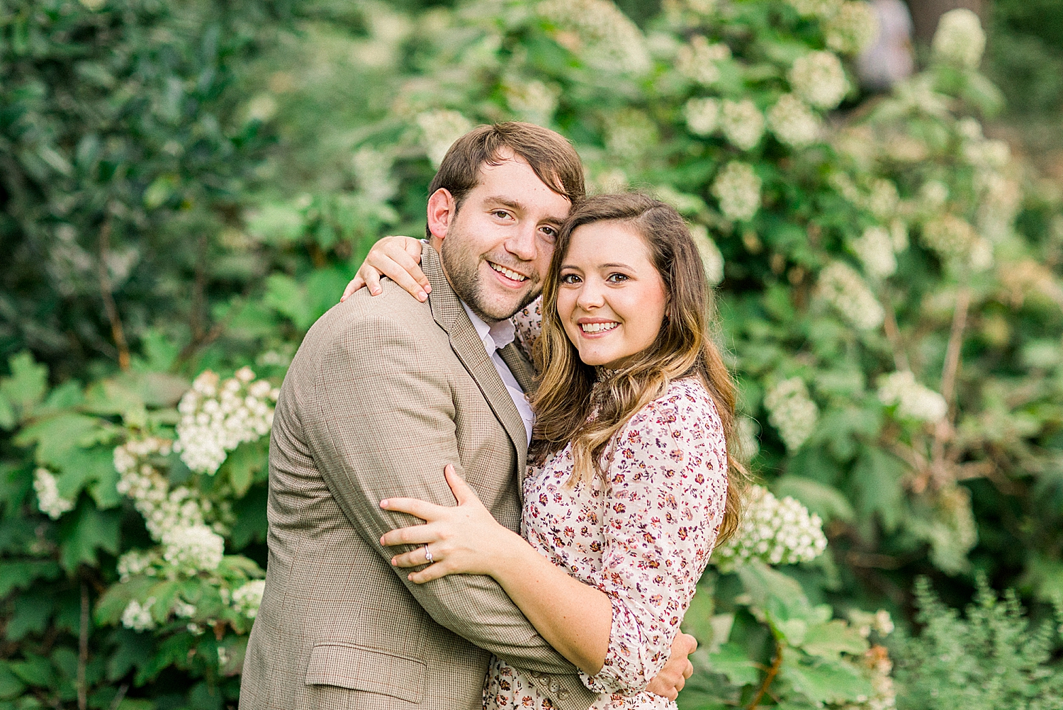 engaged couple leans heads together during Alabama engagement session