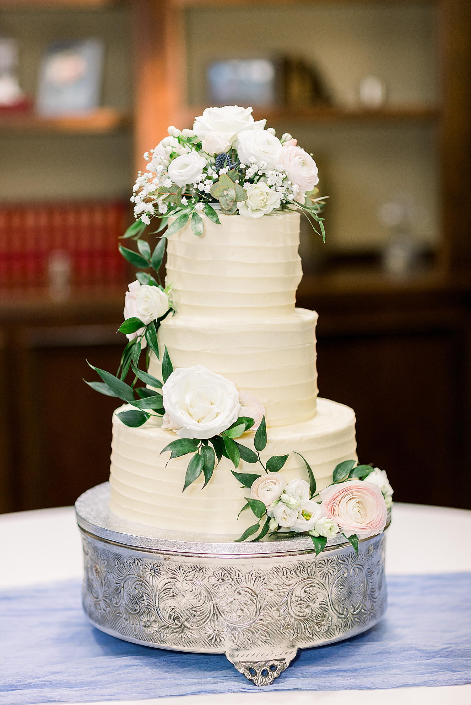 tiered wedding cake with florals