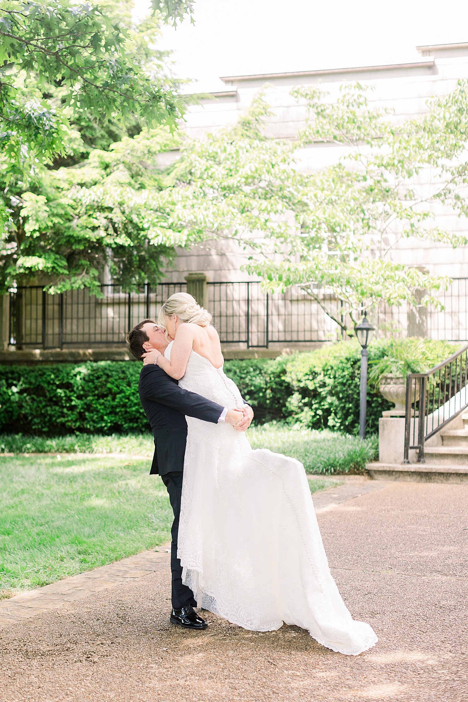bride and groom kiss during AL wedding photos