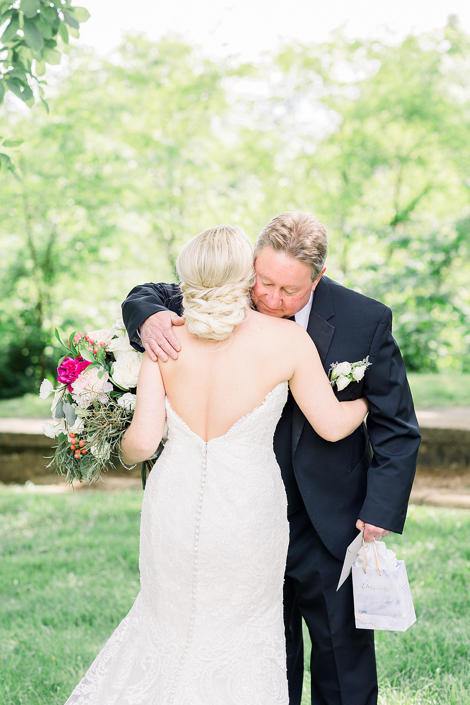 bride and dad hug during first look at Burritt on the Mountain