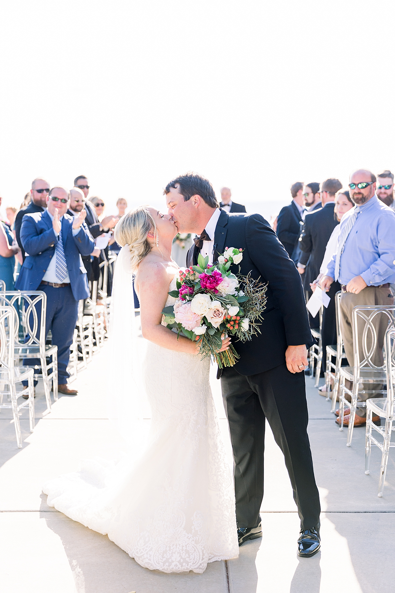 newlyweds kiss at end of aisle at The View