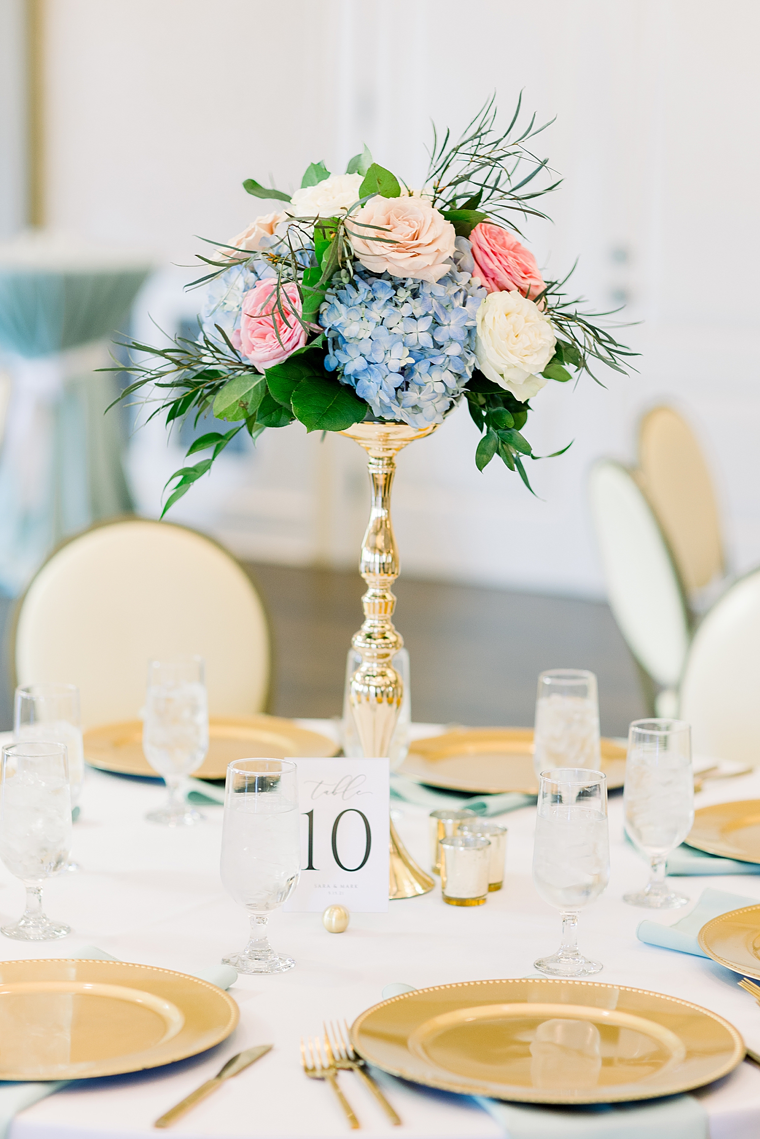wedding reception centerpiece with pink and blue flowers