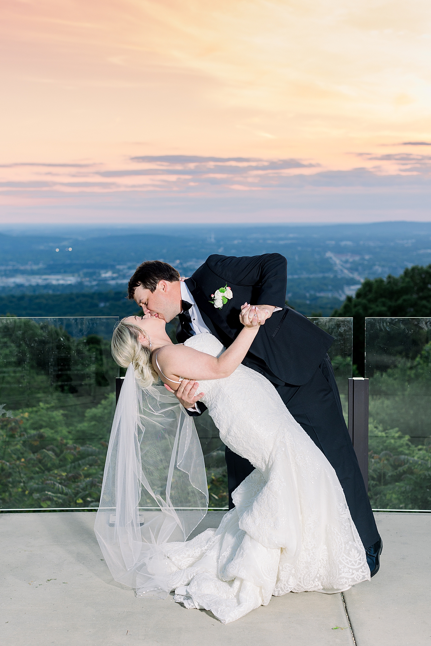 sunset wedding portraits on balcony at Huntsville AL venue