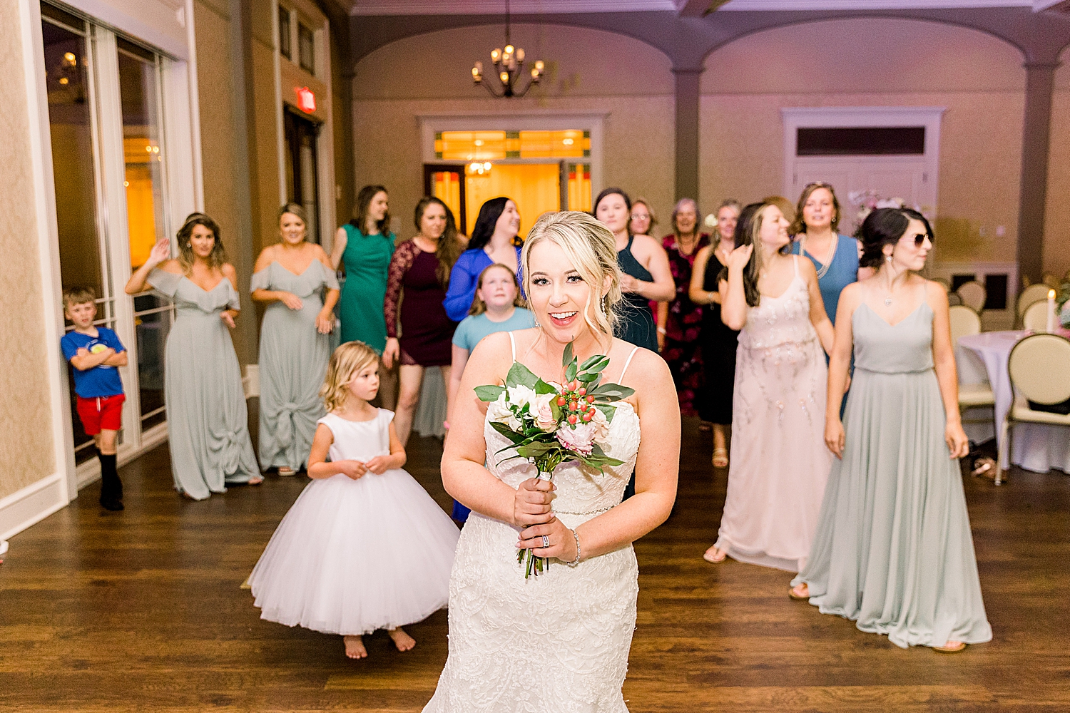 bride prepares to throw bouquet during Huntsville AL wedding reception