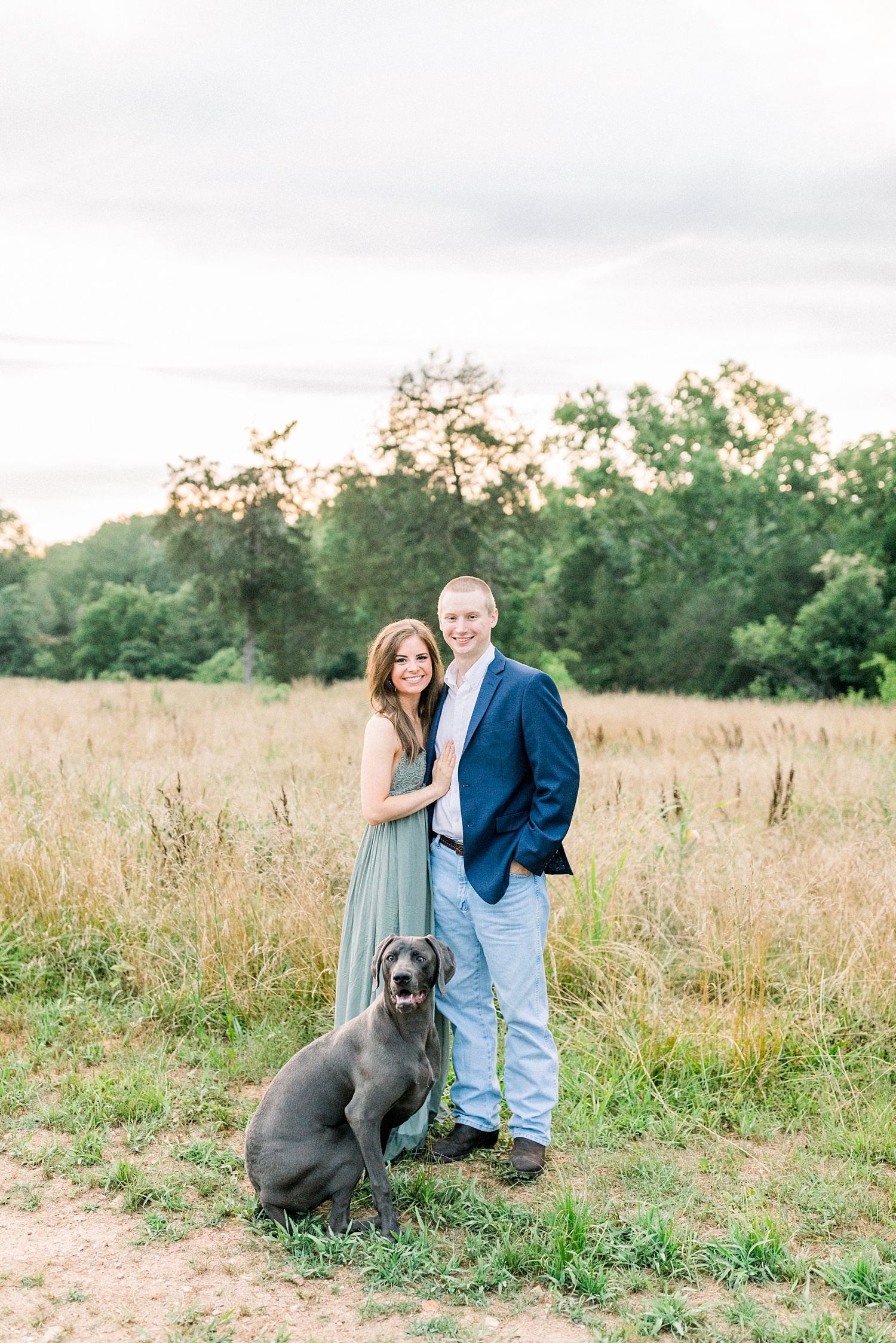 couple poses with dog at end of Montevallo AL engagement session