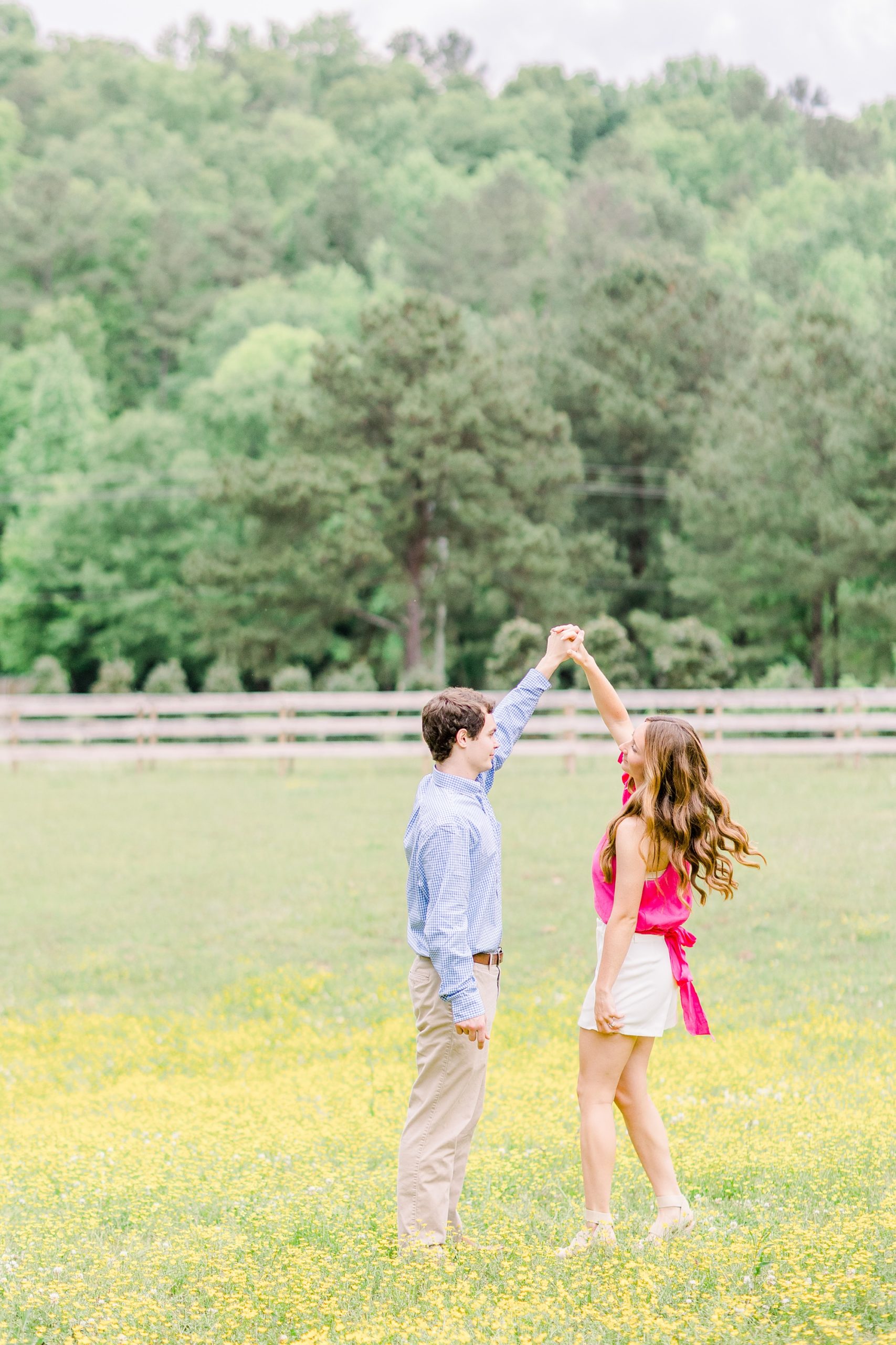 bride and groom dance in field of yellow flowers