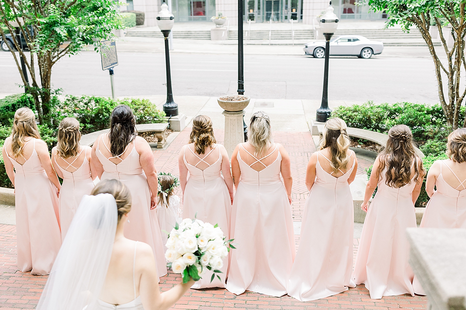 bride and bridesmaids have first look at Tutwiler Hotel