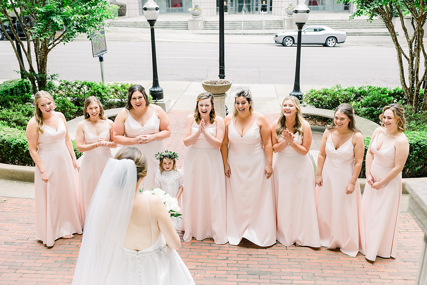 bridesmaids cheer during first look in Alabama
