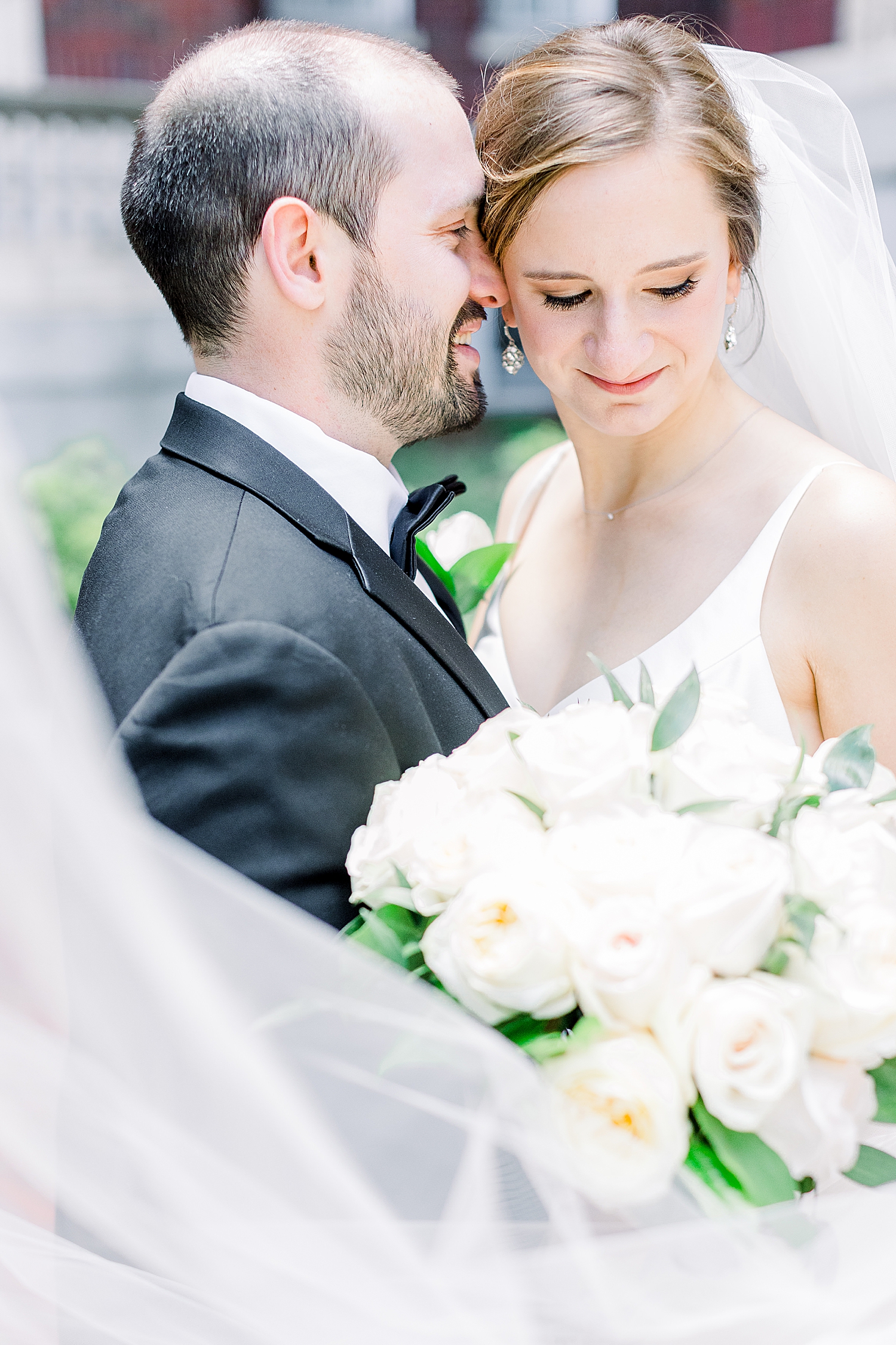 groom nuzzles bride's cheek during Tutwiler Hotel wedding portraits