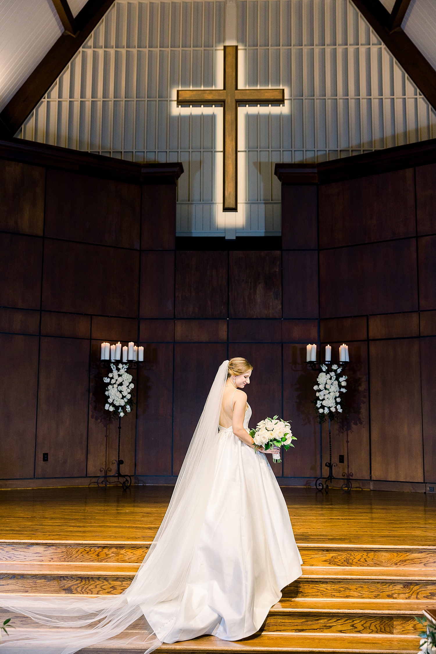 bride poses on alter at Mountain Brook Community Church