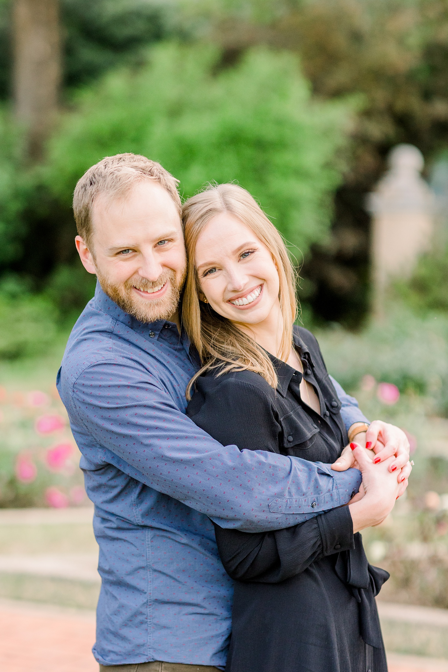 Alabama couple hugs in garden during engagement photos