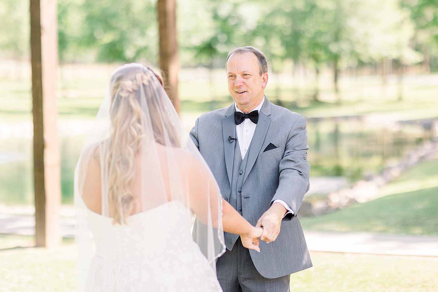 dad looks at bride during first look