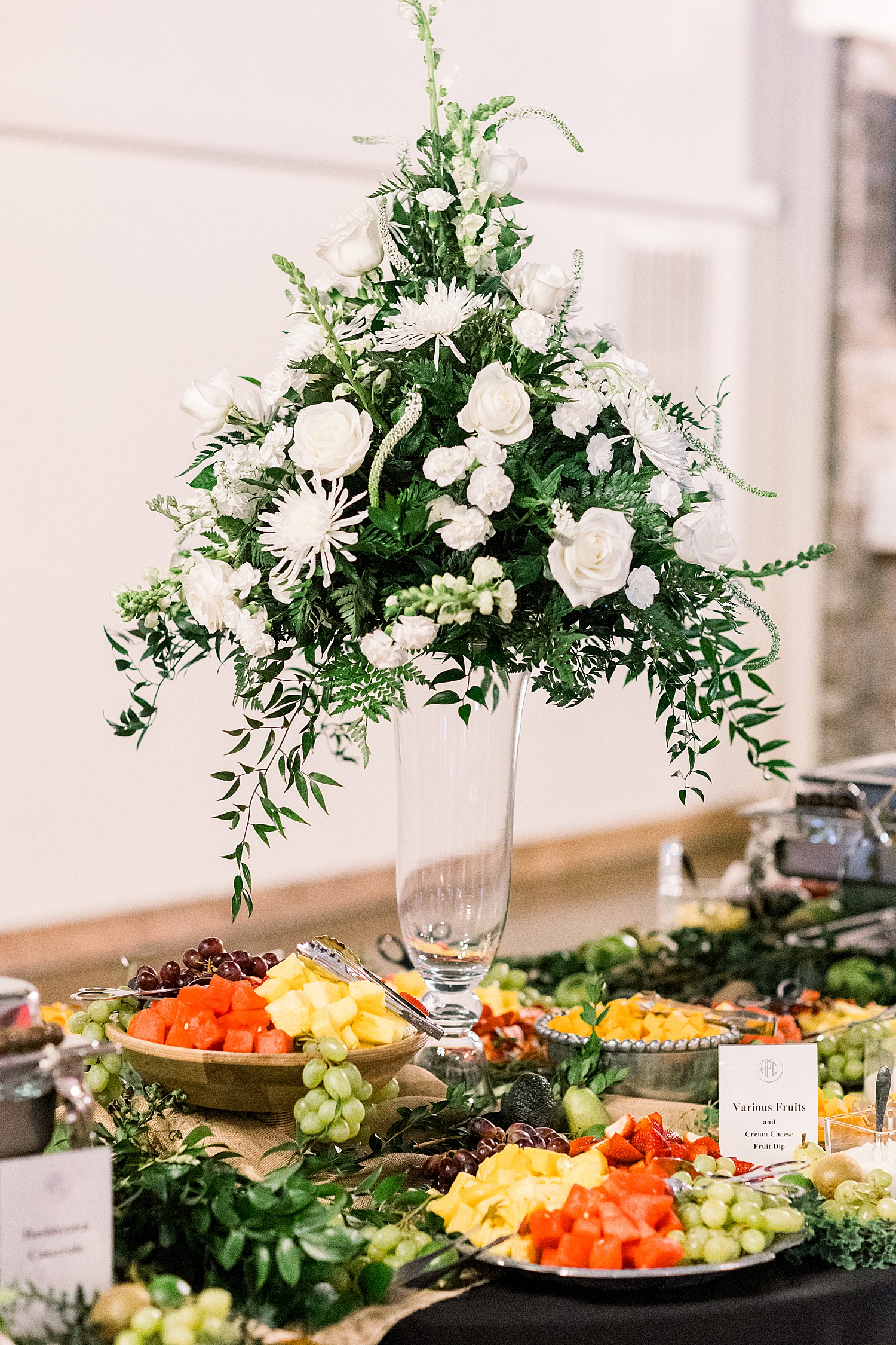 tall floral centerpiece for food table at Douglas Manor