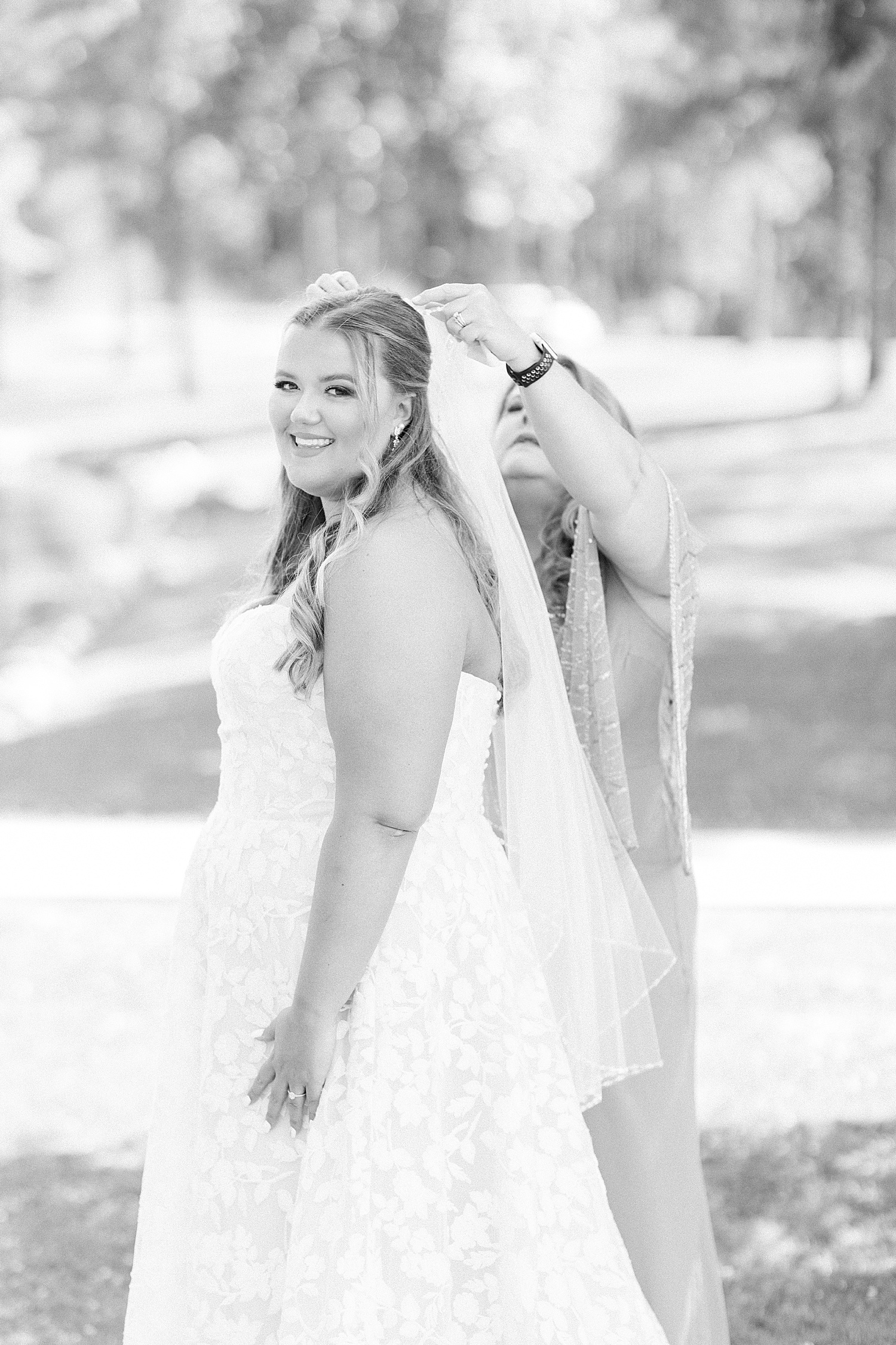 mother helps bride with veil before Alabama wedding