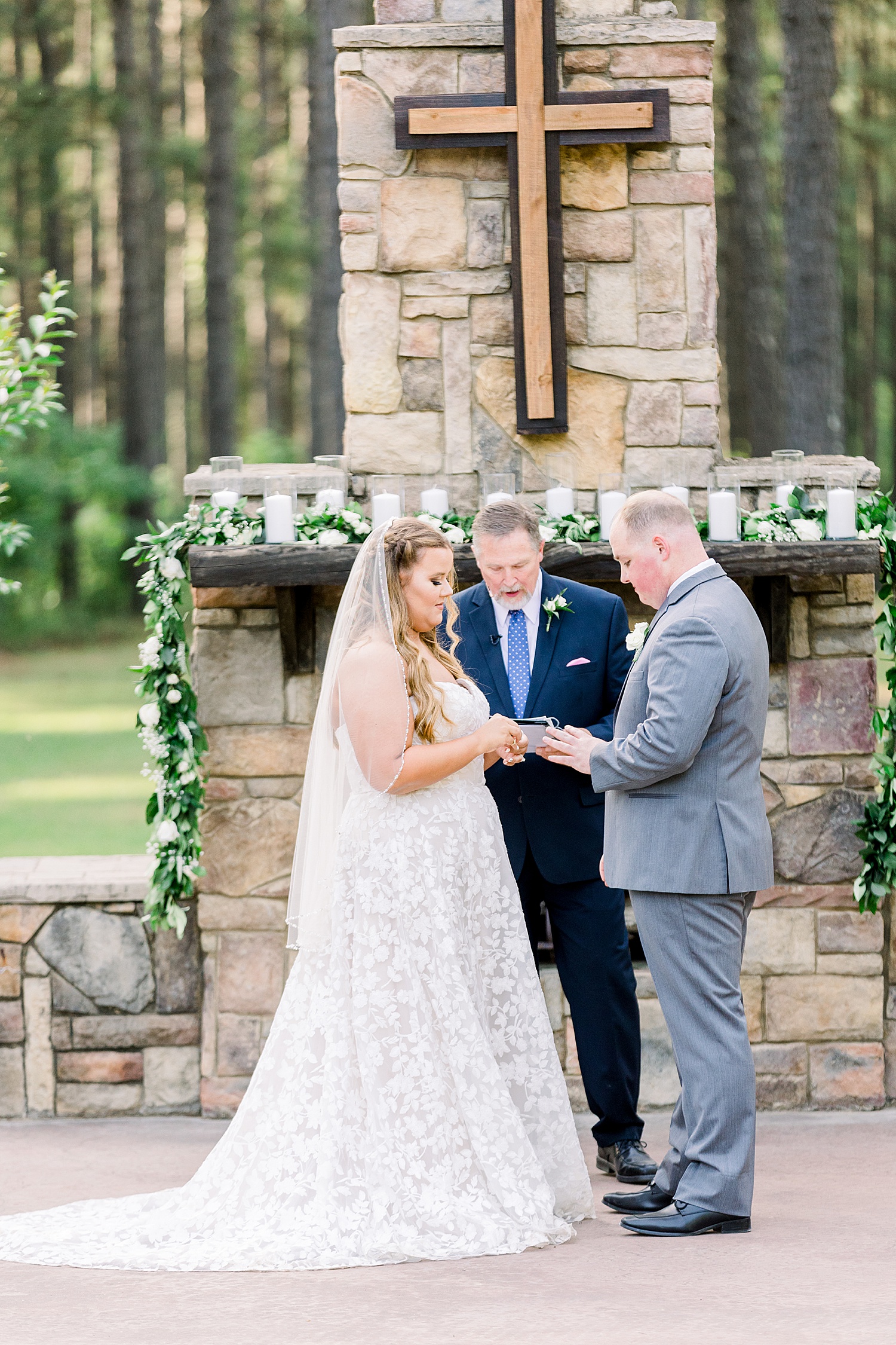 couple exchanges vows during outdoor ceremony at Douglas Manor