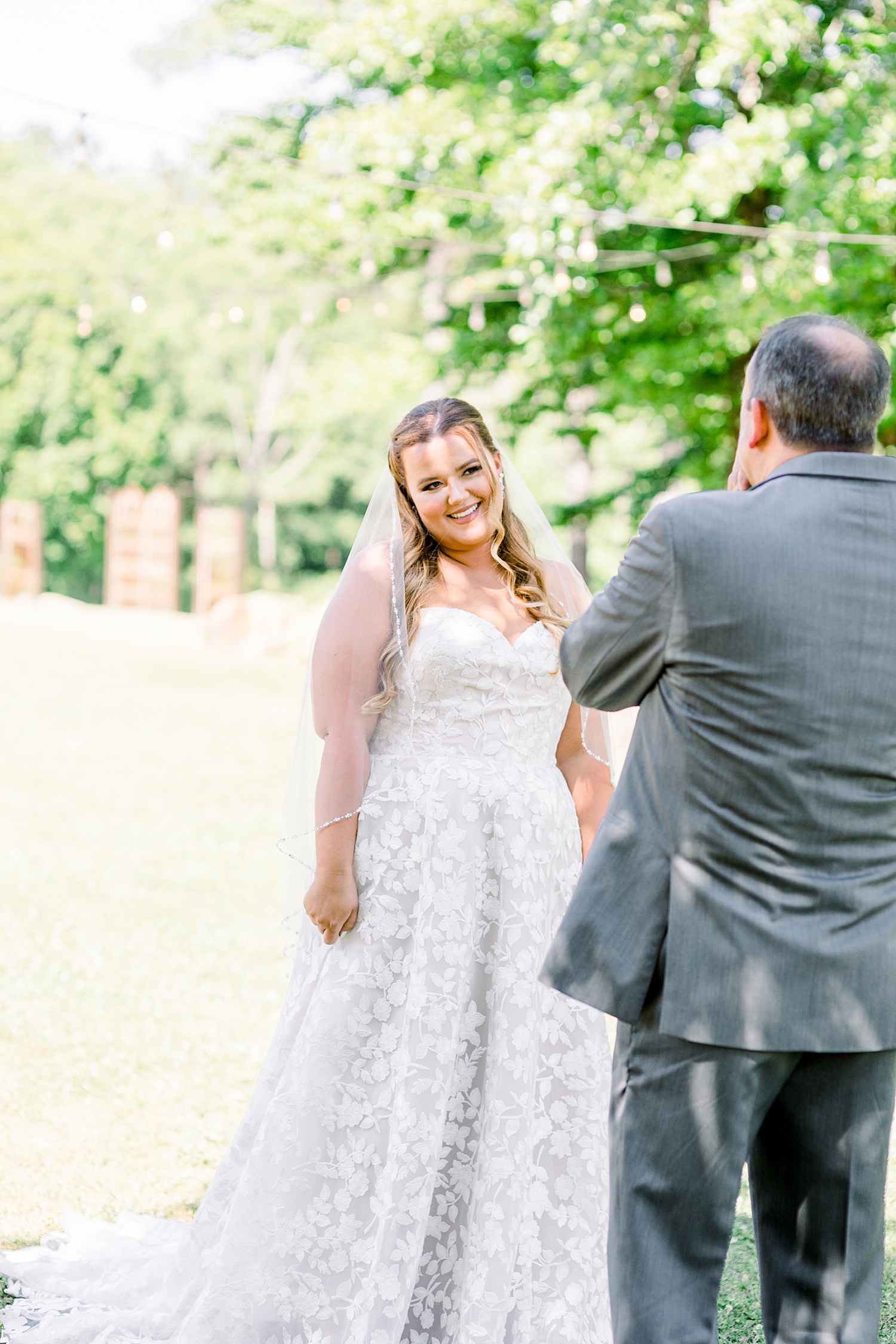 bride and dad have first look before Alabama wedding