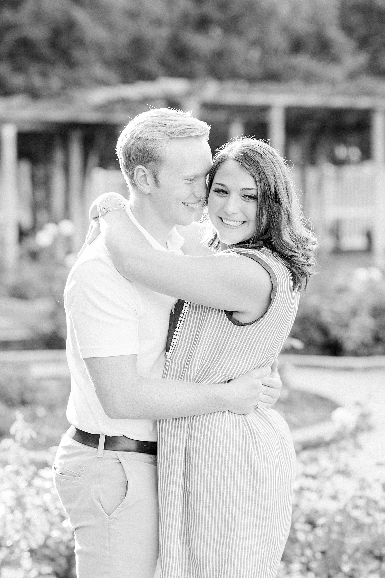 bride and groom hug during Downtown Birmingham engagement session