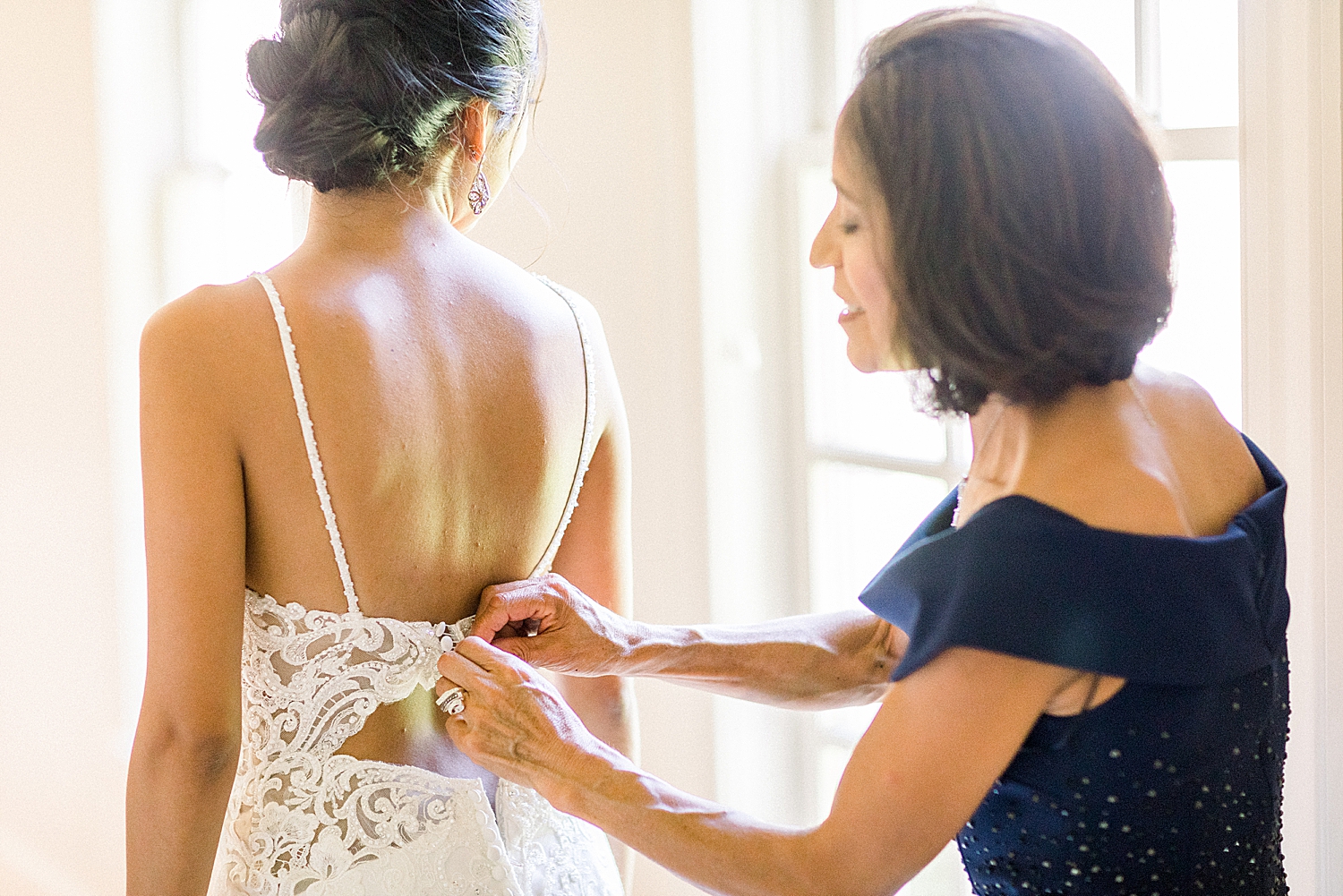 mother helps bride prepare for Preserve Town Hall wedding