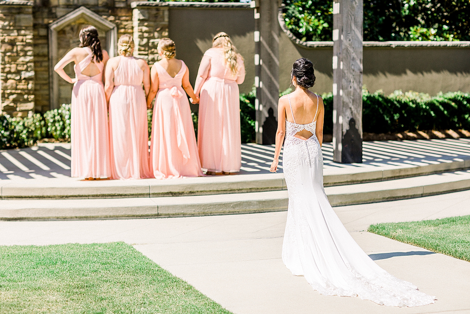 bride walks up to bridesmaids for first look