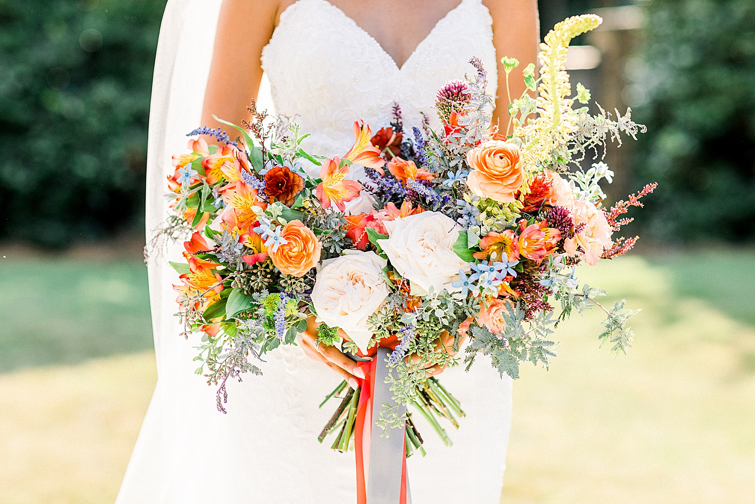 bride's bouquet with bright orange flowers