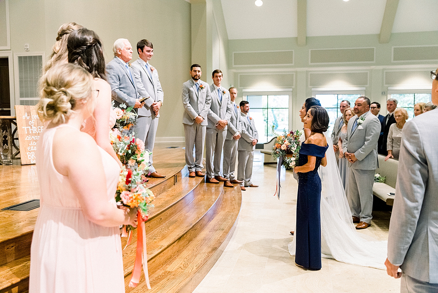 parents give away bride during AL church ceremony