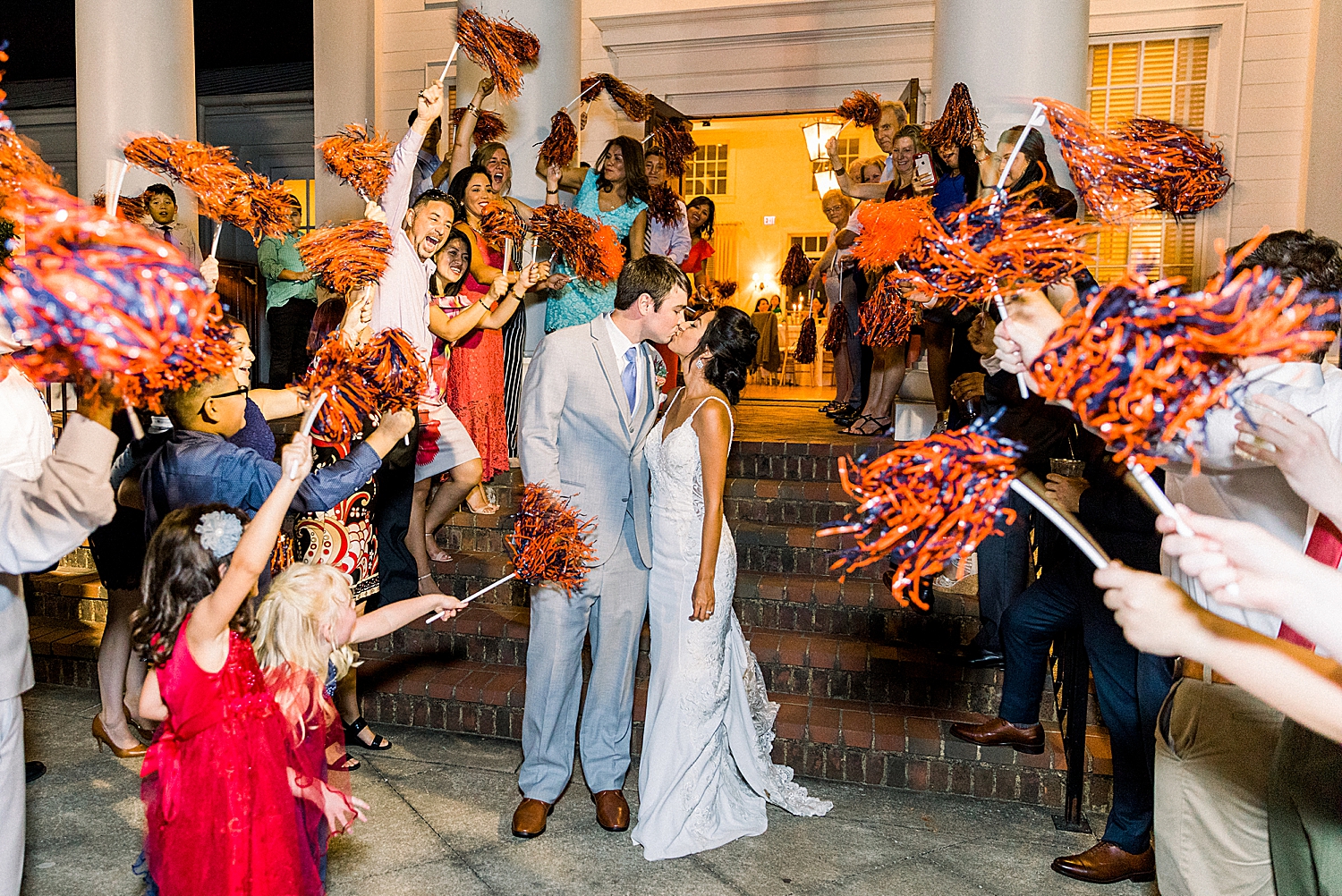 newlyweds kiss during pom pom exit from Birmingham AL reception