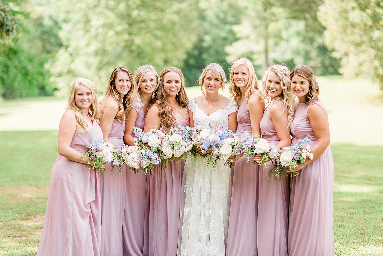Bride and Bridesmaids in dusty pink dresses before Applewood Farms AL Wedding