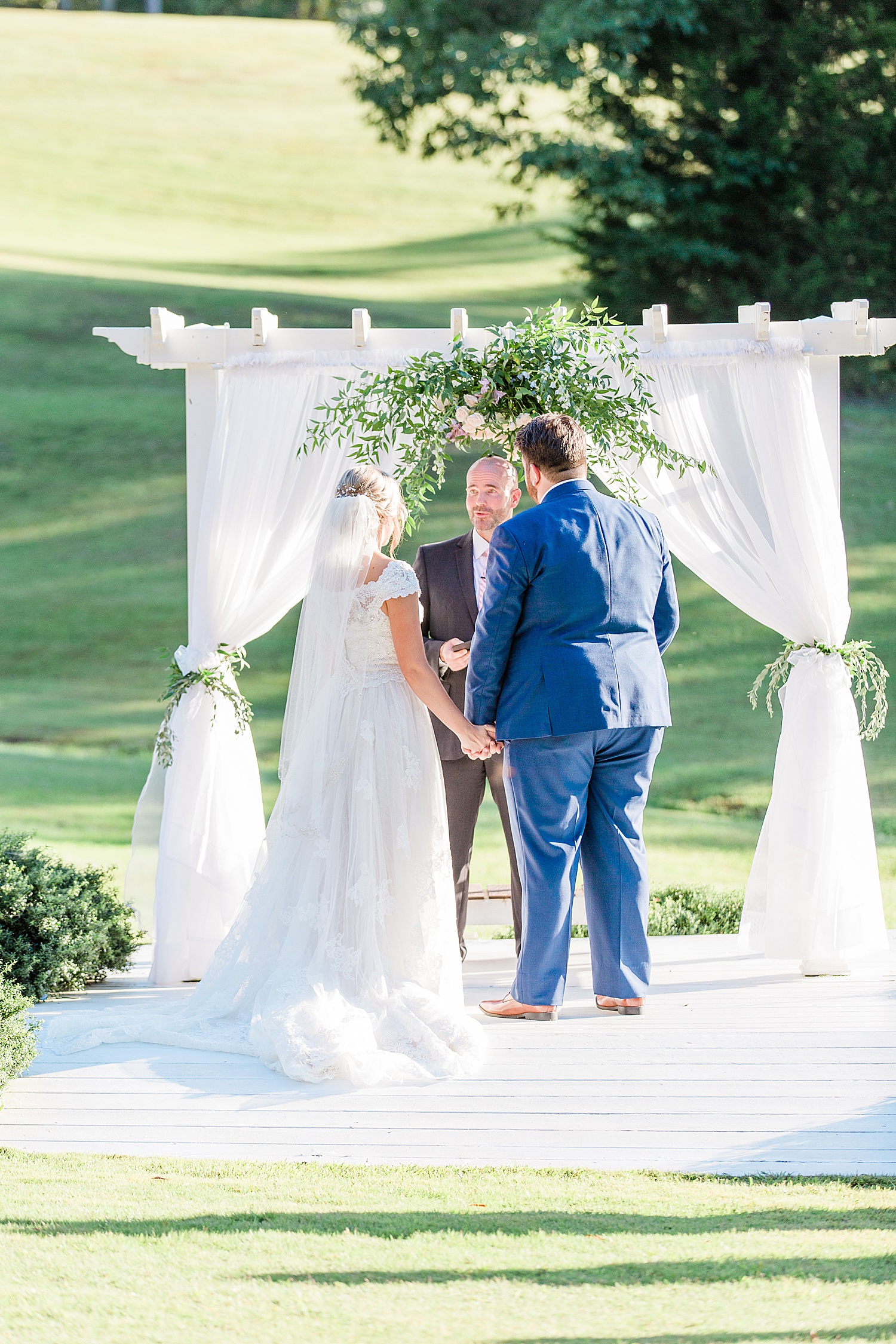 couple during wedding ceremony at Alabama applewood farms wedding by chelsea morton photography