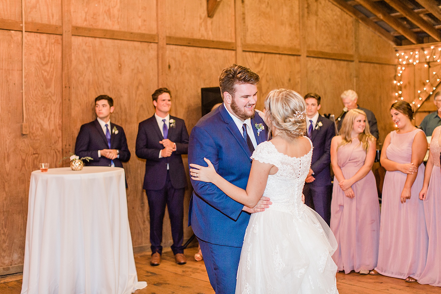 bride and groom share first dance at AL reception