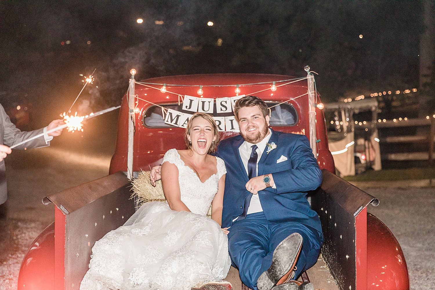 bride and groom on getaway vehicle at the end of their Alabama wedding
