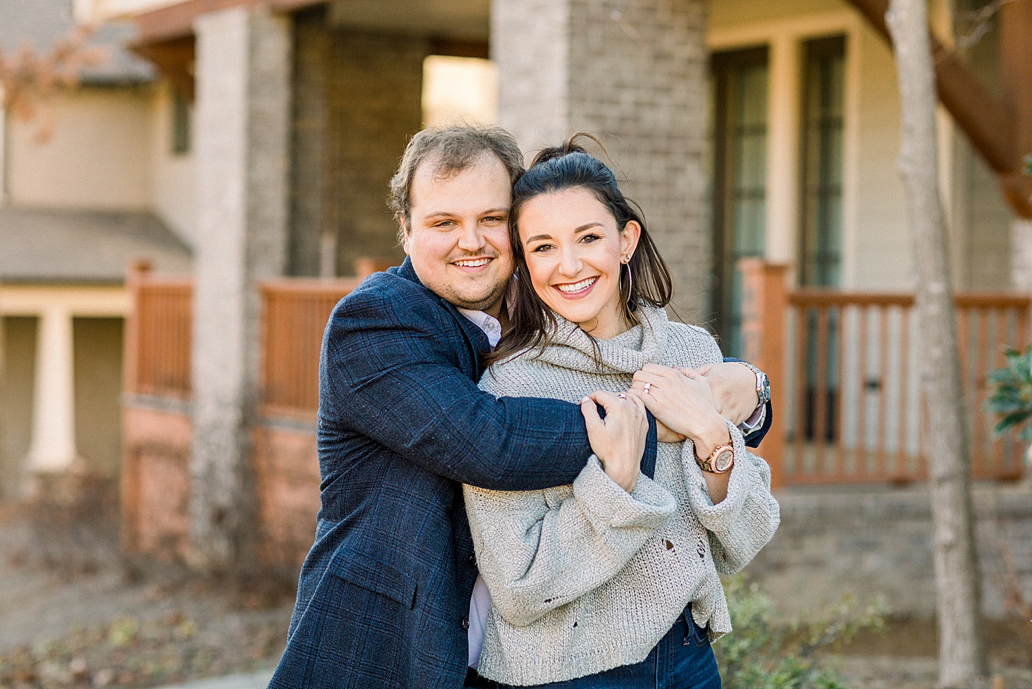 man hugs his fiance during engagement session in Birmingham AL