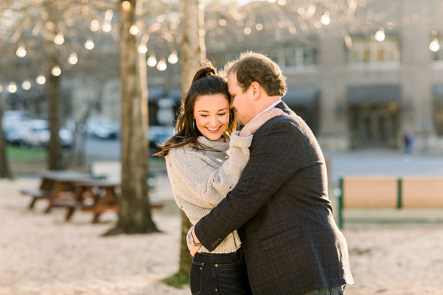 couple dances and laughs in grass during Mount Laurel Engagement Session in Birmingham AL by Chelsea Morton Photography