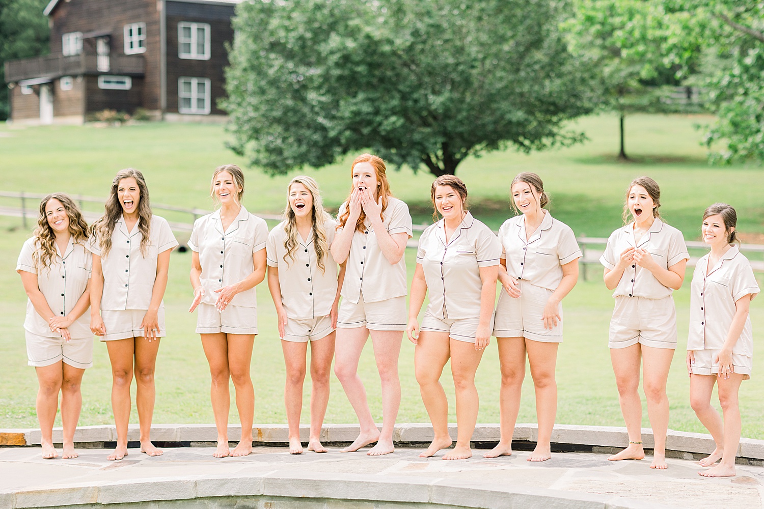 Bride does first look with bridesmaids at Alabama wedding