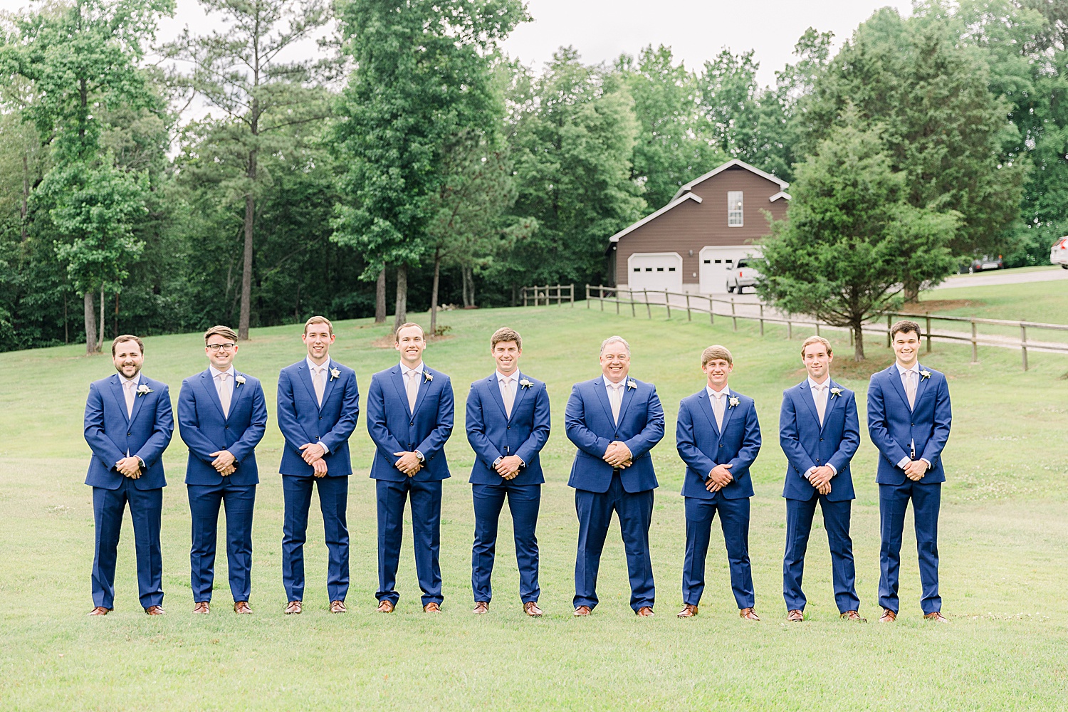 Groom and Groomsmen stand together before wedding ceremony