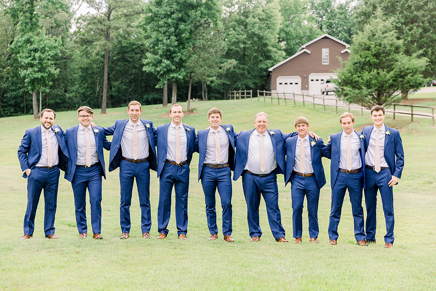 Groom and Groomsmen stand together before wedding ceremony in Alabama