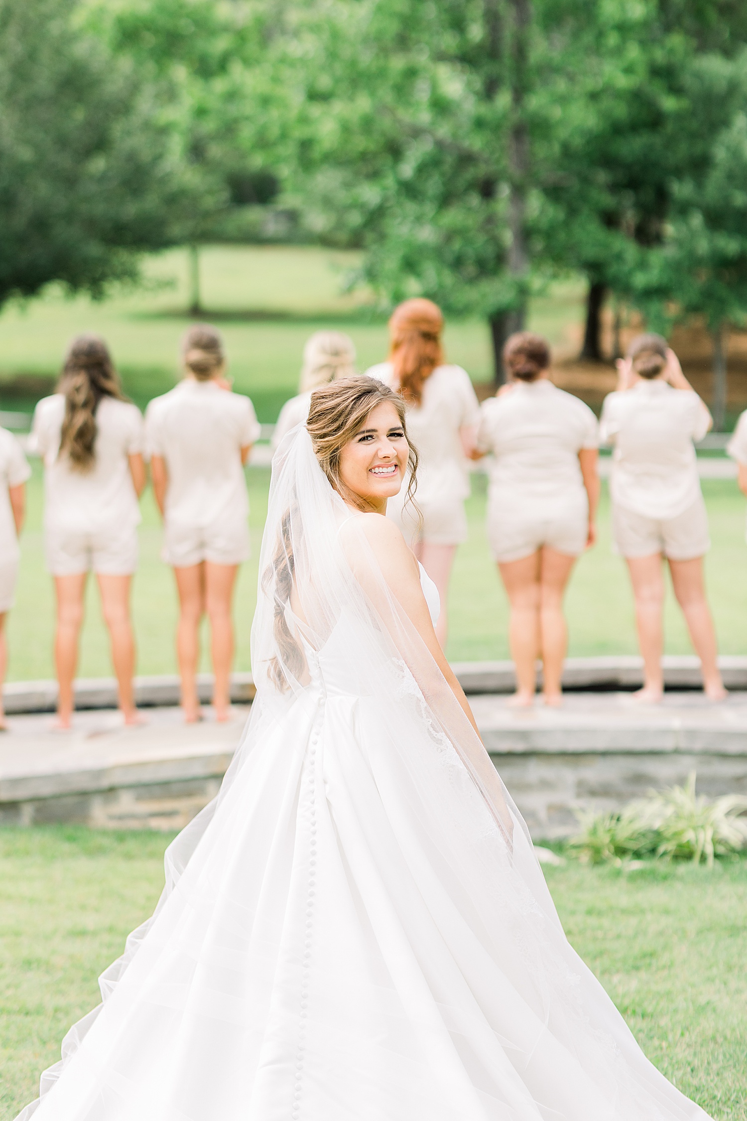 Bride before first look with bridesmaids at The Barn at Shady Lane in AL