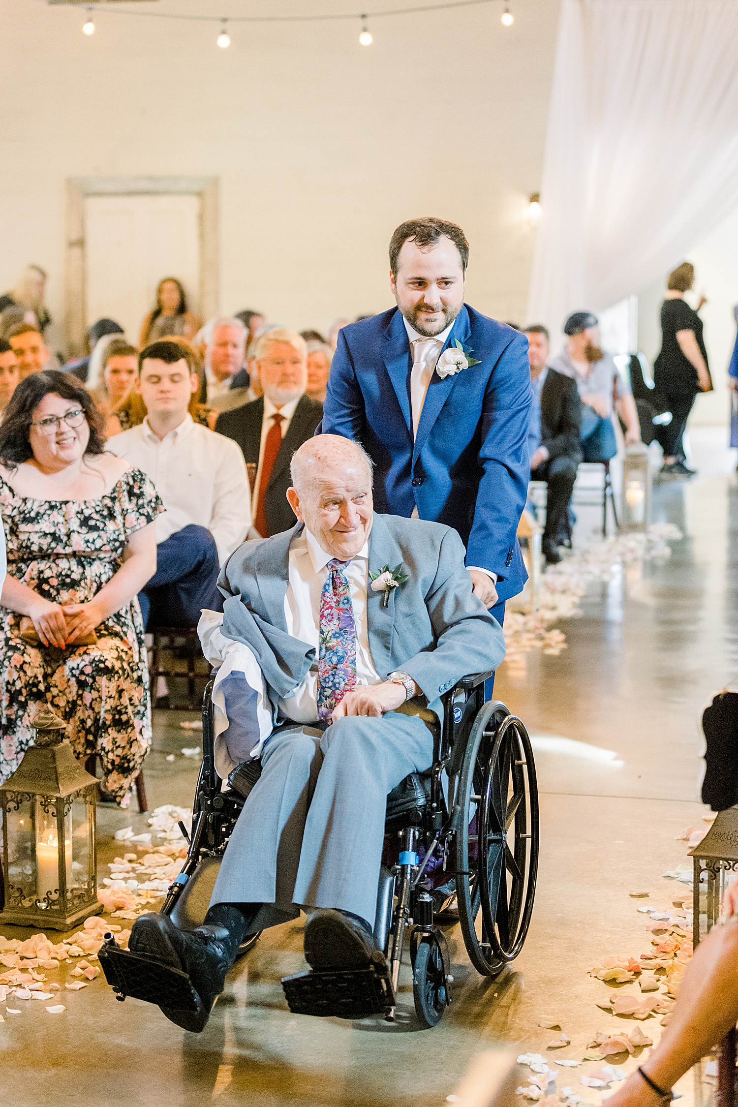 grandfather takes seat at Wedding ceremony at The Barn at Shady Lane in Birmingham, Alabama